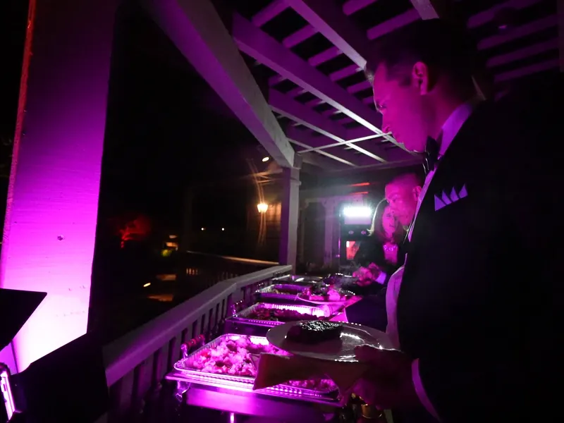 Chafing dishes holding entrées warm at an evening Half Moon Bay event