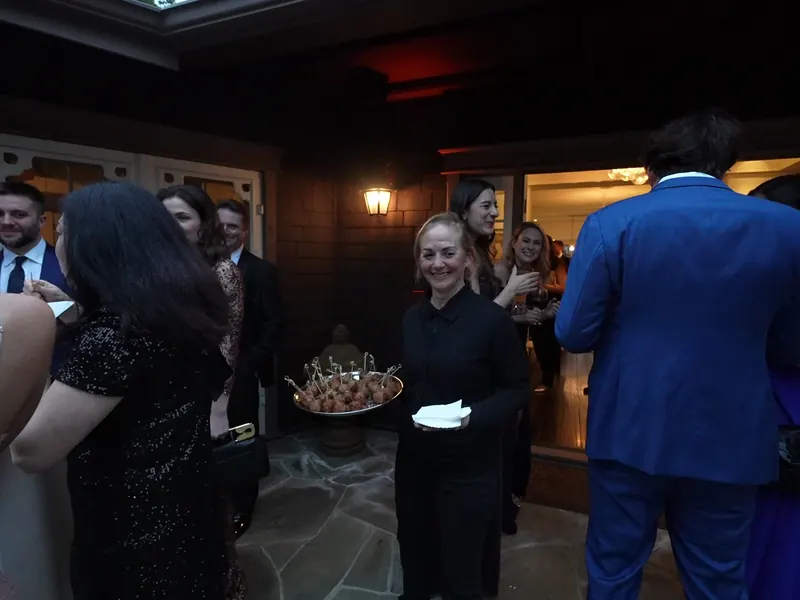Passed appetizers circulating among guests at a Pacifica gathering