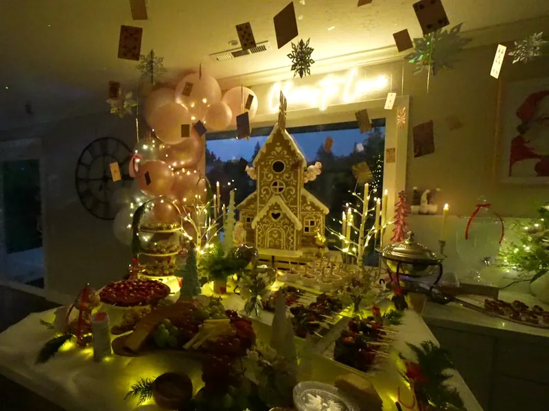 Warmly lit dessert table at an indoor San Bruno gathering