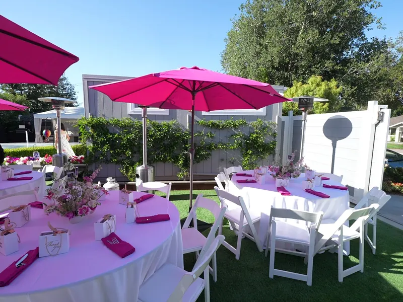 Lawn tables set with linens for a Belmont graduation party